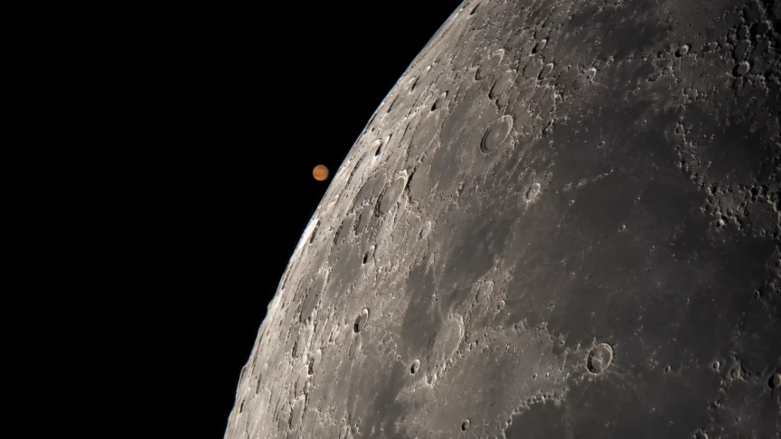 Mars beside the cratered limb of the Moon moments before an occultation